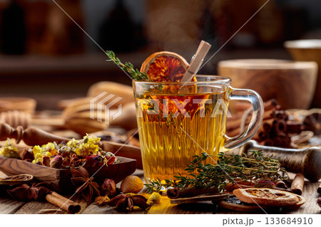 Herbal tea with thyme and dried orange slice. Herbal tea with thyme and dried orange slice. 133684910