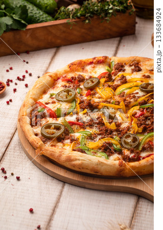 Mexican style pizza with jalapeno peppers Mexican style pizza with jalapeno peppers 133684924