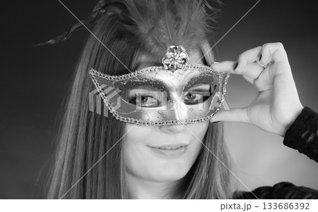 Sensual woman with carnival mask. 133686392