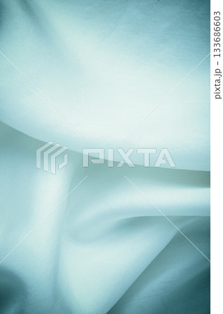 Folds of navy blue silk textile background 133686603