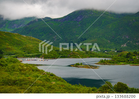 Fjord landscape with fishing boats in port 133688200