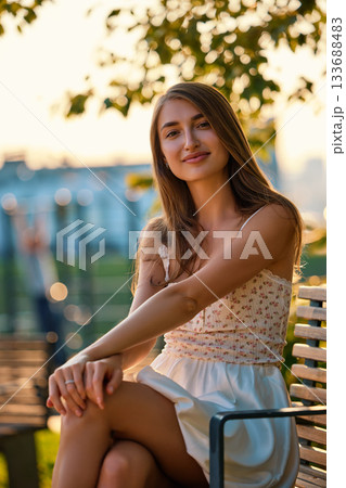 Slavic Woman in White Dress at Golden Hour 133688483