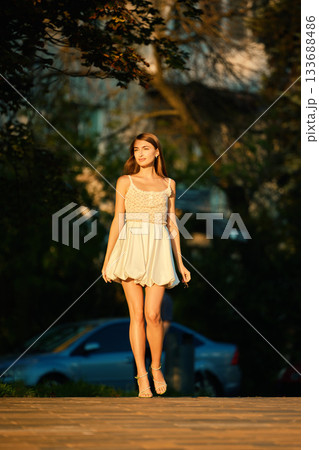 Slavic Woman Walking in Warm Golden Light Slavic Woman Walking in Warm Golden Light 133688486