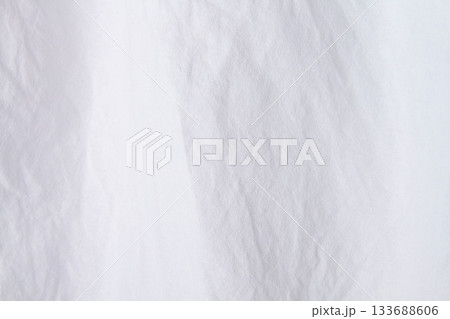 Texture of white fabric. White background close up. Factory fabric in white. Texture of white fabric. White background close up. Factory fabric in white. 133688606
