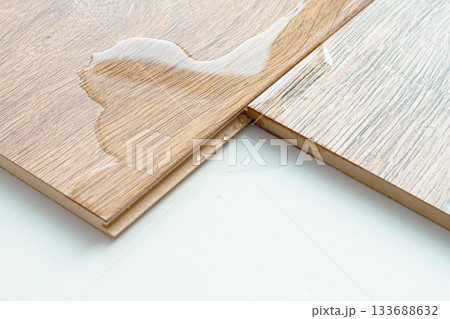 Laminate and water. Wooden floors are impervious to moisture. 133688632