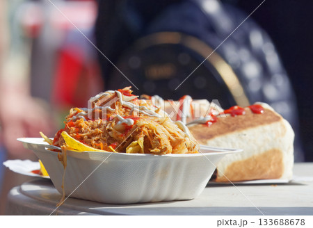 Street food meal with corn chips and pulled meat served at a food festival in Karlin, Prague 133688678