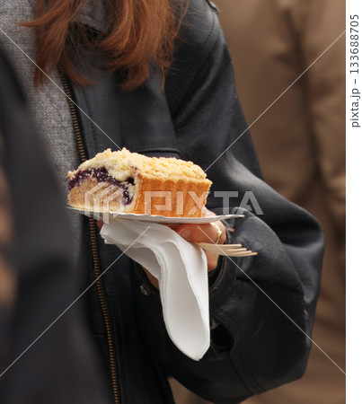 Slice of berry crumble cake at food festival 133688705