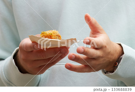 Man holding baklava dessert at Prague farmers market 133688839