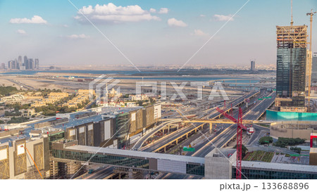 Aerial view of Financial center road timelapse with under construction building 133688896