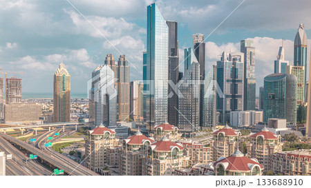 Aerial view of skyscrapers and road junction in Dubai timelapse 133688910