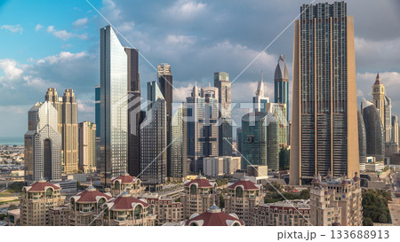 Aerial view on downtown and financial district in Dubai timelapse, United Arab Emirates with skyscrapers and highways. 133688913
