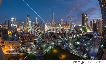 Dubai Downtown skyline night to day timelapse with Burj Khalifa and other towers panoramic view from the top in Dubai 133688959