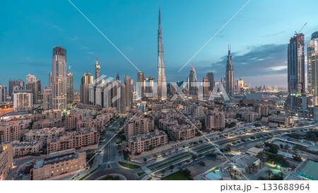 Dubai Downtown skyline night to day timelapse with Burj Khalifa and other towers panoramic view from the top in Dubai 133688964