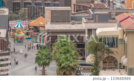 Aerial view of beach and tourists walking and sunbathing on holiday in JBR timelapse in Dubai, UAE Aerial view of beach and tourists walking and sunbathing on holiday in JBR timelapse in Dubai, UAE 133688989