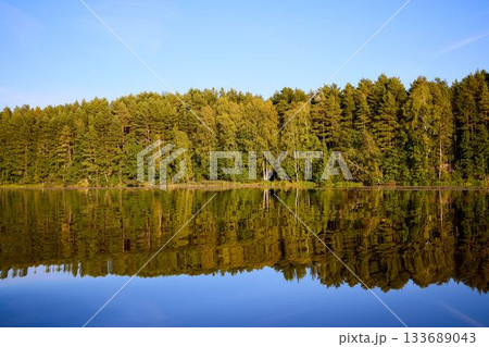 Tranquil River Reflections of Autumn Trees Tranquil River Reflections of Autumn Trees 133689043