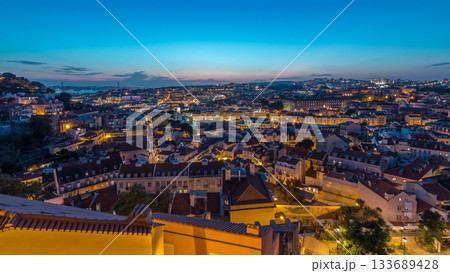 Lisbon panorama after sunset aerial view of city centre with red roofs at autumn day to night timelapse, Portugal Lisbon panorama after sunset aerial view of city centre with red roofs at autumn day to night timelapse, Portugal 133689428