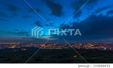 Panoramic view over Lisbon and Almada from a viewpoint in Monsanto night to day timelapse. 133689435