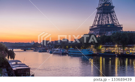 Eiffel Tower and the Seine river night to day timelapse, Paris, France 133689439