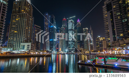 Dubai marina bay with yachts an boats night timelapse hyperlapse Dubai marina bay with yachts an boats night timelapse hyperlapse 133689563