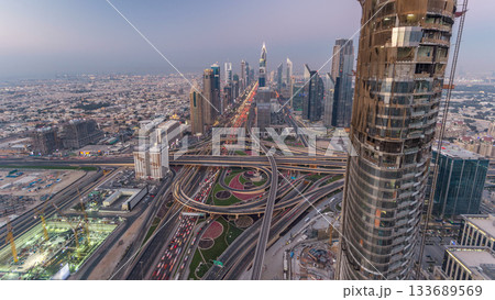 Scenic Dubai downtown skyline day to night timelapse. Rooftop view of Sheikh Zayed road 133689569