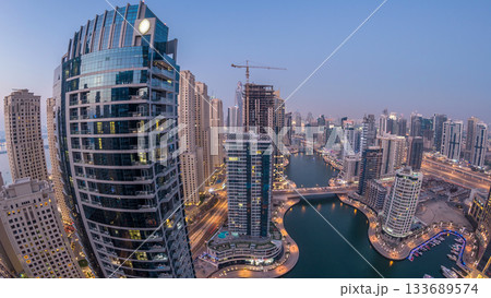 Beautiful aerial top view day to night transition timelapse of Dubai Marina canal Beautiful aerial top view day to night transition timelapse of Dubai Marina canal 133689574