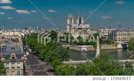 Paris Panorama with Cite Island and Cathedral Notre Dame de Paris timelapse from the Arab World Institute observation deck. France. Paris Panorama with Cite Island and Cathedral Notre Dame de Paris timelapse from the Arab World Institute observation deck. France. 133689637
