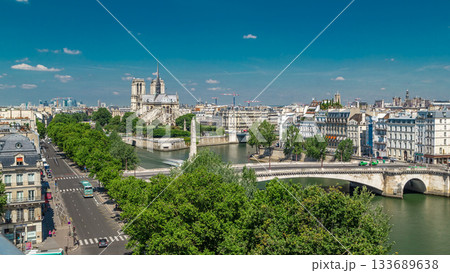 Paris Panorama with Cite Island and Cathedral Notre Dame de Paris timelapse from the Arab World Institute observation deck. France. Paris Panorama with Cite Island and Cathedral Notre Dame de Paris timelapse from the Arab World Institute observation deck. France. 133689638