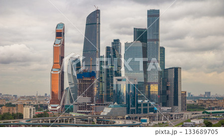Business complex of skyscrapers Moscow city timelapse. In the foreground the railway and automobile overpass. 133689705
