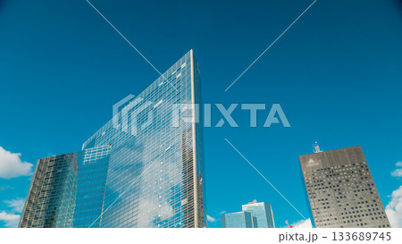 Unique skyscraper timelapse in famous financial and business district of Paris - La Defense. Unique skyscraper timelapse in famous financial and business district of Paris - La Defense. 133689745