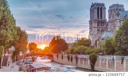 Sunset view of Cathedral Notre Dame de Paris timelapse in Paris, France. Sunset view of Cathedral Notre Dame de Paris timelapse in Paris, France. 133689757