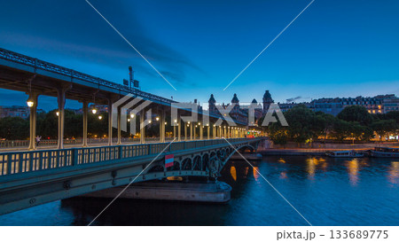 View of pont de Bir-Hakeim day to night timelapse - a bridge that crosses the Seine River. Paris, France View of pont de Bir-Hakeim day to night timelapse - a bridge that crosses the Seine River. Paris, France 133689775