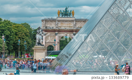 The Arc de Triomphe du Carrousel with reflections timelapse in Paris. 133689779