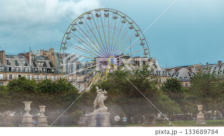 Ferris wheel Roue de Paris on Tuileries Garden timelapse. Paris, France. 133689784