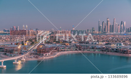 Jumeirah Palm island skyline day to night timelapse in Dubai, UAE. Jumeirah Palm island skyline day to night timelapse in Dubai, UAE. 133689896