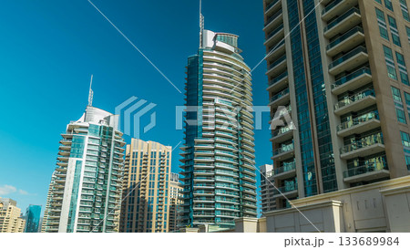 Dubai Marina towers and canal in Dubai timelapse hyperlapse 133689984