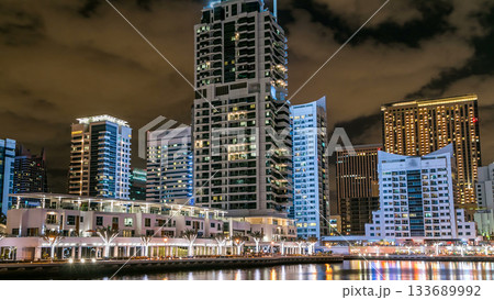 Dubai Marina towers and canal in Dubai night timelapse Dubai Marina towers and canal in Dubai night timelapse 133689992