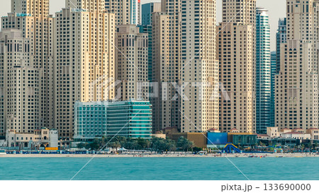 Jumeirah Beach Residence as seen from the palm jumeirah with sea timelapse. Dubai, United Arab Emirates 133690000