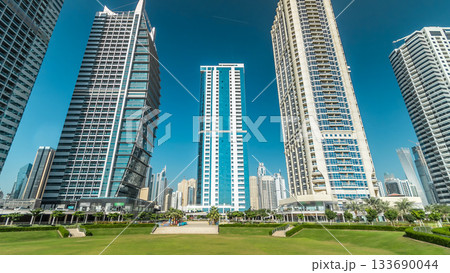 Residential buildings in Jumeirah Lake Towers timelapse hyperlapse in Dubai, UAE. 133690044