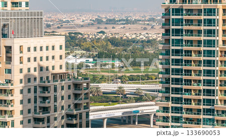 Golf field timelapse from top at day time with traffic on sheikh zayed road. 133690053