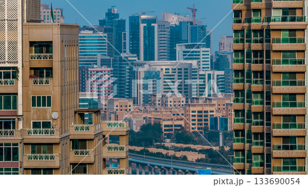 Golf field timelapse from top at day time with traffic on sheikh zayed road. 133690054