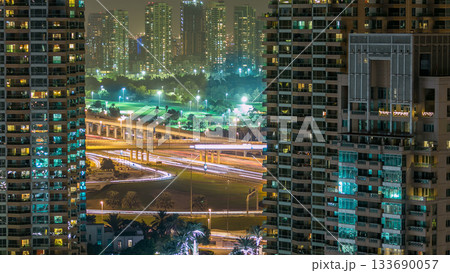 Golf field timelapse from top at night time with traffic on sheikh zayed road. 133690057