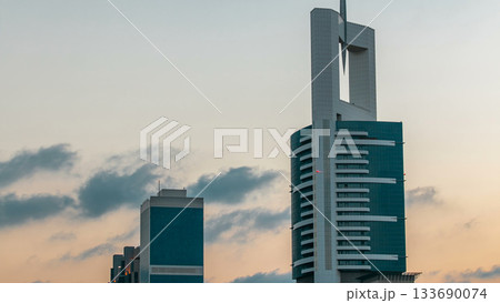 Downtown Dubai towers in the evening timelapse. Aerial view of Sheikh Zayed road with skyscrapers at sunset. Downtown Dubai towers in the evening timelapse. Aerial view of Sheikh Zayed road with skyscrapers at sunset. 133690074