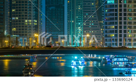 Promenade in Dubai Marina timelapse at night, UAE. 133690124