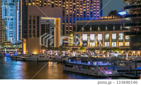 Dubai Marina towers and canal in Dubai day to night timelapse 133690140