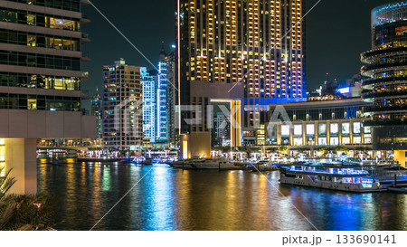 Dubai Marina towers and canal in Dubai night timelapse 133690141