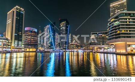 Dubai Marina towers and canal in Dubai night timelapse 133690145