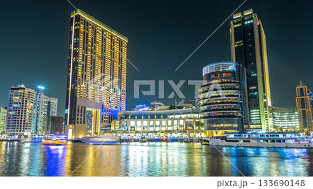 Dubai Marina towers and canal in Dubai night timelapse hyperlapse 133690148