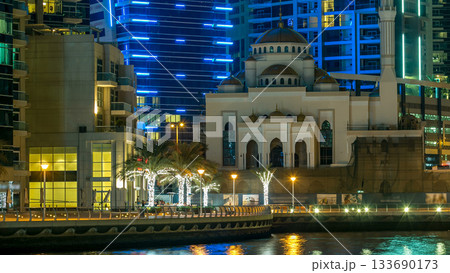 Mosque among modern high rise buildings, towers and hotels timelapse at Dubai Marina, United Arab Emirates, Middle East Mosque among modern high rise buildings, towers and hotels timelapse at Dubai Marina, United Arab Emirates, Middle East 133690173
