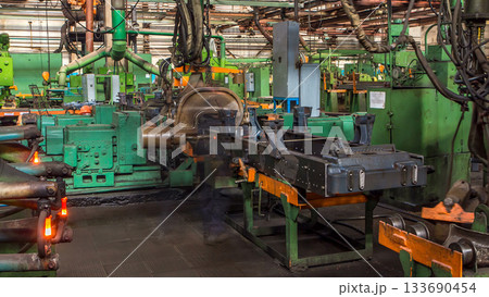 Conveyor assembly stage the body of tractor at big industrial factory timelapse Conveyor assembly stage the body of tractor at big industrial factory timelapse 133690454