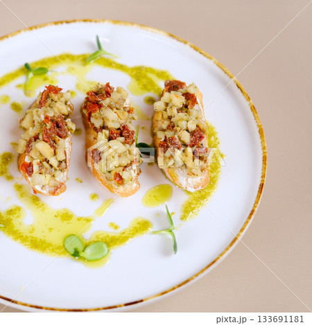 Bruschettas with seafood and vegetables. Start dishes with salmon, crab and cucumber. Delicious snacks with chorizo, burrata and baked tomatoes. Food composition, tasty italian meal Bruschettas with seafood and vegetables. Start dishes with salmon, crab and cucumber. Delicious snacks with chorizo, burrata and baked tomatoes. Food composition, tasty italian meal 133691181